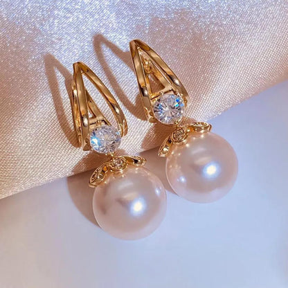 【Compre uno y llévese otro gratis】 Pendientes de plata con perlas de lujo francés de nuevo estilo